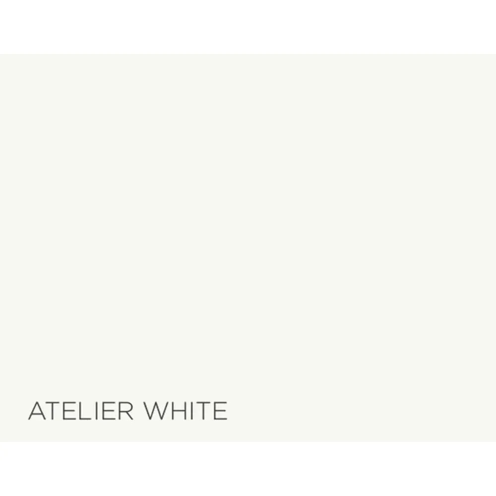 A flat color swatch labeled 'ATELIER WHITE' in dark gray text at the bottom left, showing a very light warm off-white color.
