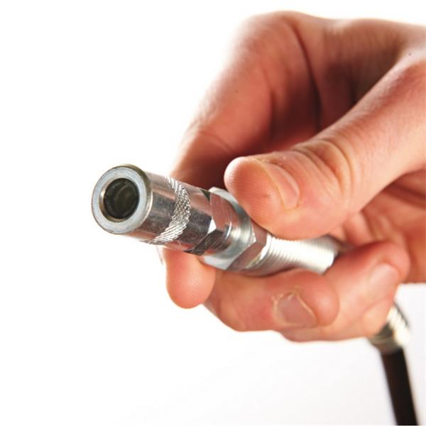 Hand holding a metal tool or component against a white background