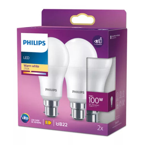 A retail box of two Philips LED light bulbs in warm white, shown on a plain white background. The packaging is predominantly purple with white, blue, and yellow label elements.