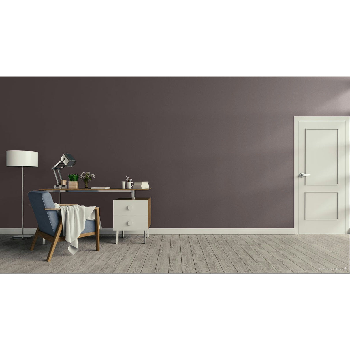 A modern interior room scene with a dark mauve-grey wall, light wood floor, white door on the right, and a home office setup on the left featuring a desk, lamp, chair, and throw blanket. Prestige Mustang Paint