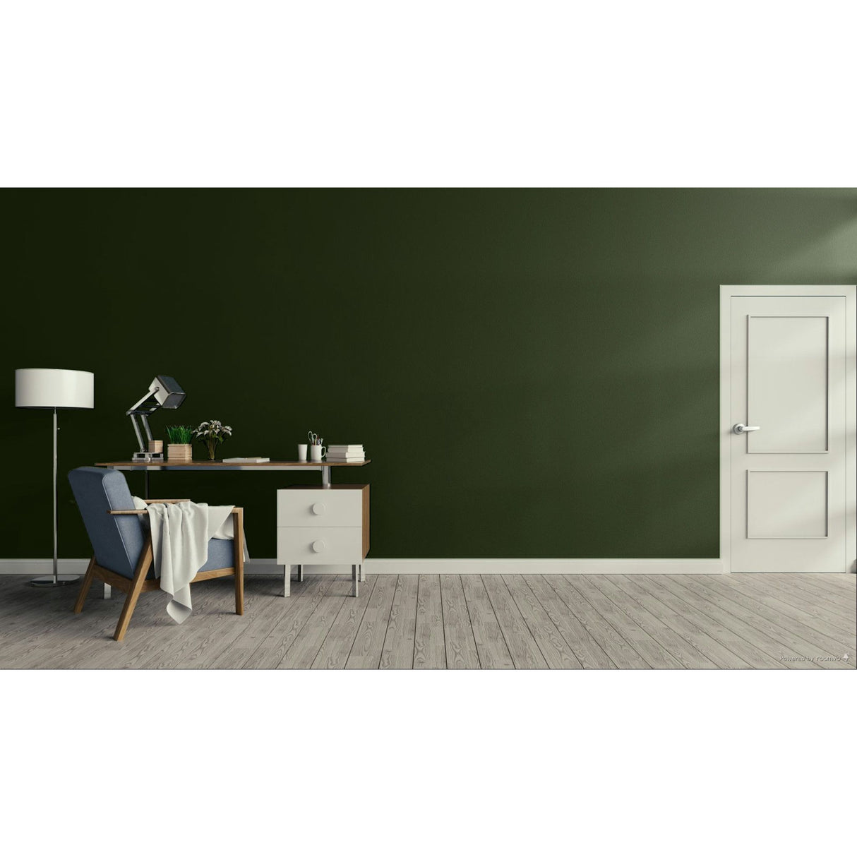 A modern interior room with a dark green wall, light wood floor, a white door on the right, and a home office setup on the left featuring a blue armchair, desk, lamp, and small cabinet.