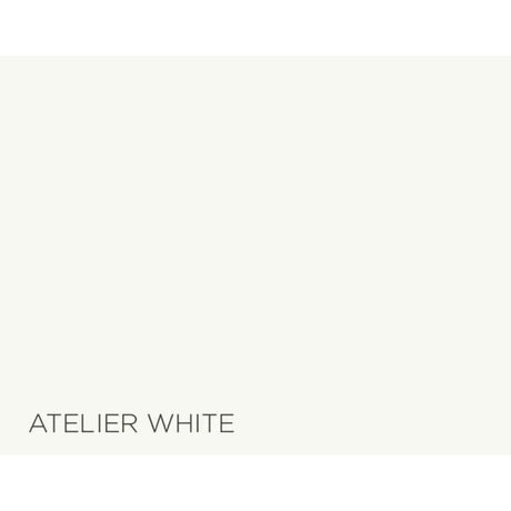 A flat color swatch labeled 'ATELIER WHITE' in dark gray text at the bottom left, showing a very light warm off-white color.