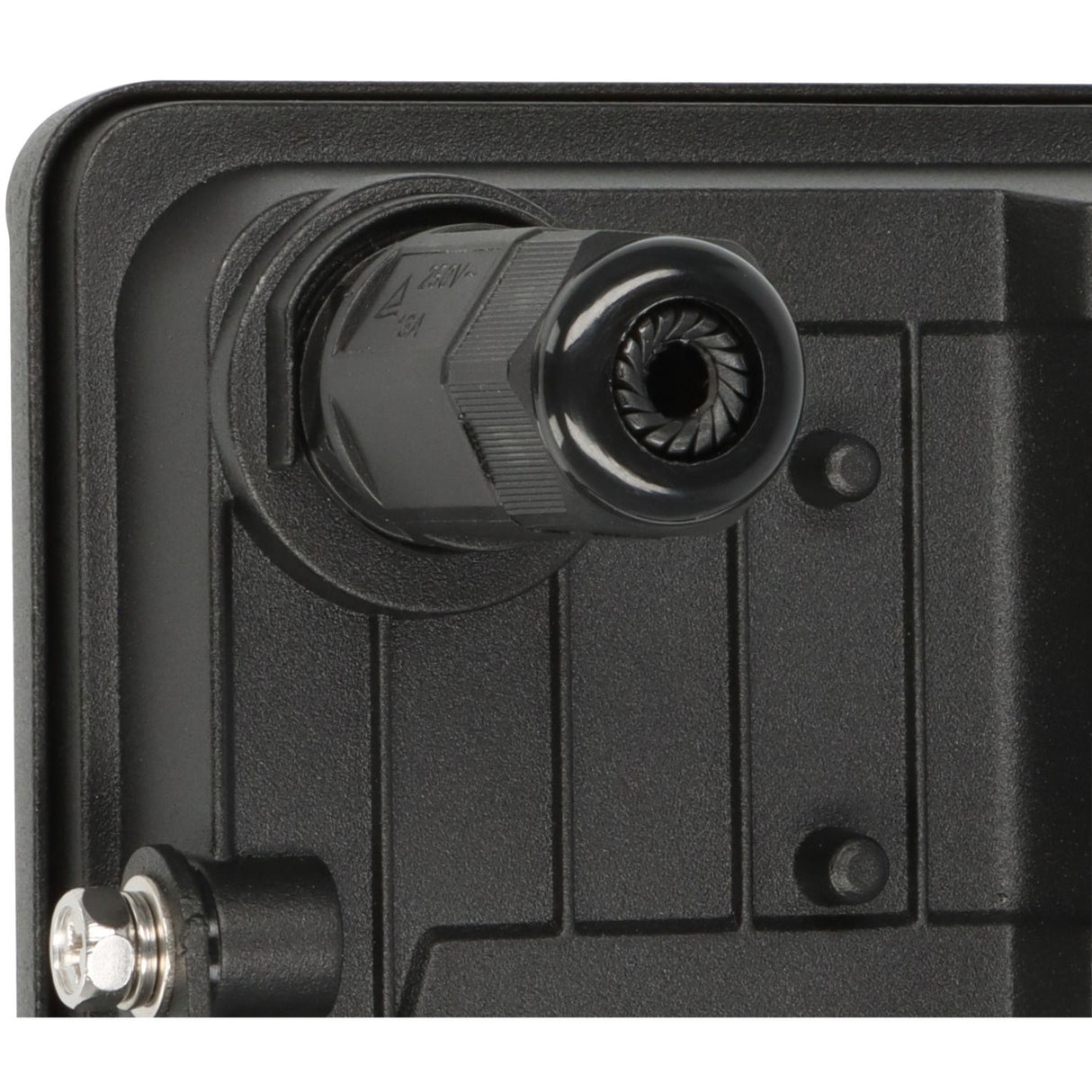 Close-up of a black electronic component with a plug on a black background