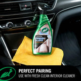 A bottle of Turtle Wax Fresh Clean car interior cleaner placed on a yellow microfiber cloth inside a car console. A black banner at the bottom reads 'PERFECT PAIRING USE WITH FRESH CLEAN INTERIOR CLEANER' with the Turtle Wax logo.