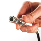 Hand holding a metal tool or component against a white background