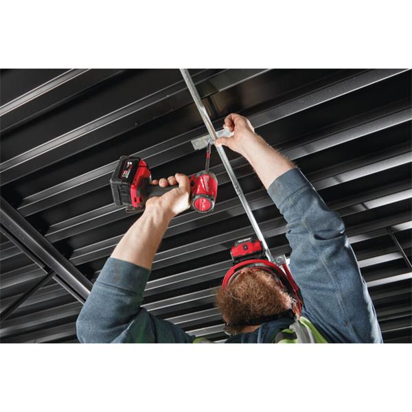 Person using a power tool on metal ceiling panels Milwaukee M18FID3-0 M18 Fuel Gen 4 Impact Driver | Bare Unit