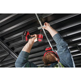 Person using a power tool on metal ceiling panels Milwaukee M18FID3-0 M18 Fuel Gen 4 Impact Driver | Bare Unit