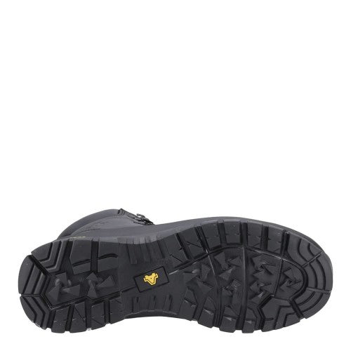 The outsole of a black rugged work boot, showing deep tread patterns and a small yellow logo, photographed against a solid white background.