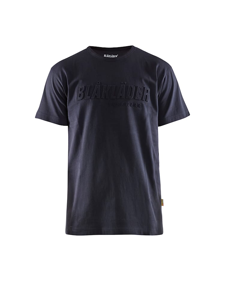 A dark navy blue short-sleeve crewneck t-shirt with 'BLÅLÄDER' printed in a tonal, raised font across the chest, shown against a plain white background.