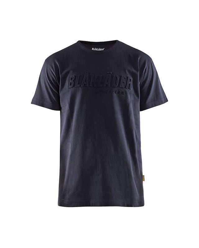 A dark navy blue short-sleeve crewneck t-shirt with 'BLÅLÄDER' printed in a tonal, raised font across the chest, shown against a plain white background.
