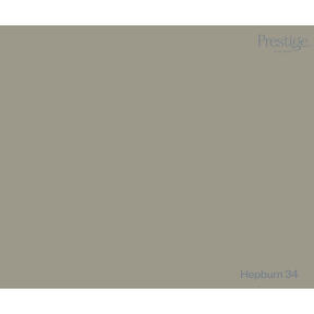 A solid color swatch card for Prestige fabric, labeled 'Hepburn 34' in the bottom right corner, featuring a muted olive-gray color.