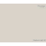 A flat, solid colour swatch card in a warm light greige, labeled 'Prestige. Fine Paint. Prestige Hepburn Light Paint
