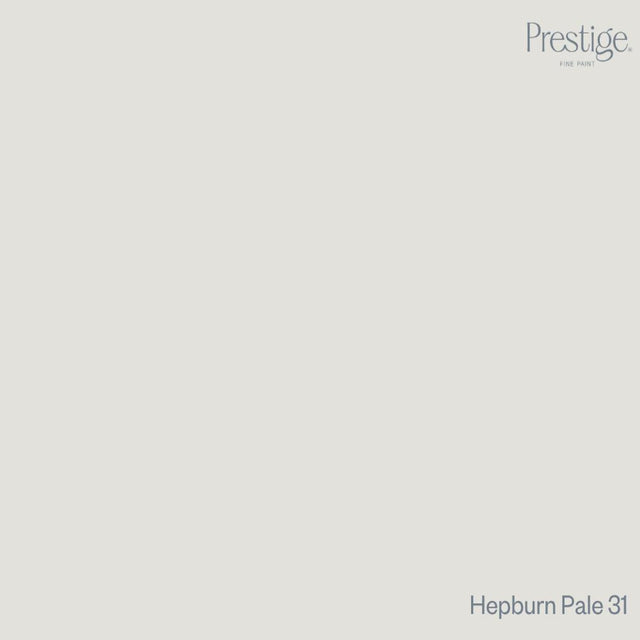 Prestige Hepburn Pale
A minimalist color swatch card featuring a solid light warm gray-beige background, with the Prestige brand logo in the top right and the text 'Hepburn Pale 31' in the bottom right.
