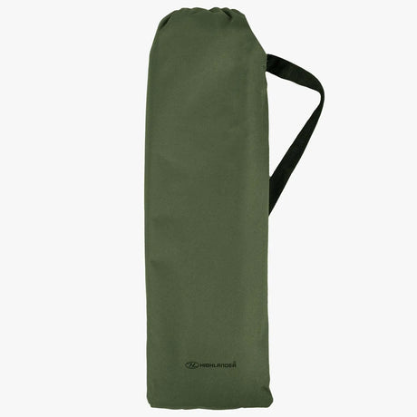 Green compression bag with a handle on a white background