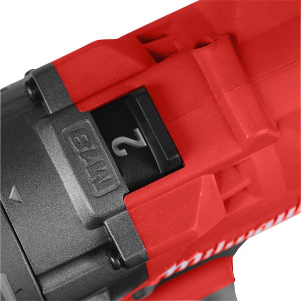 Close-up of a red and black power tool with 'Milwaukee' branding.