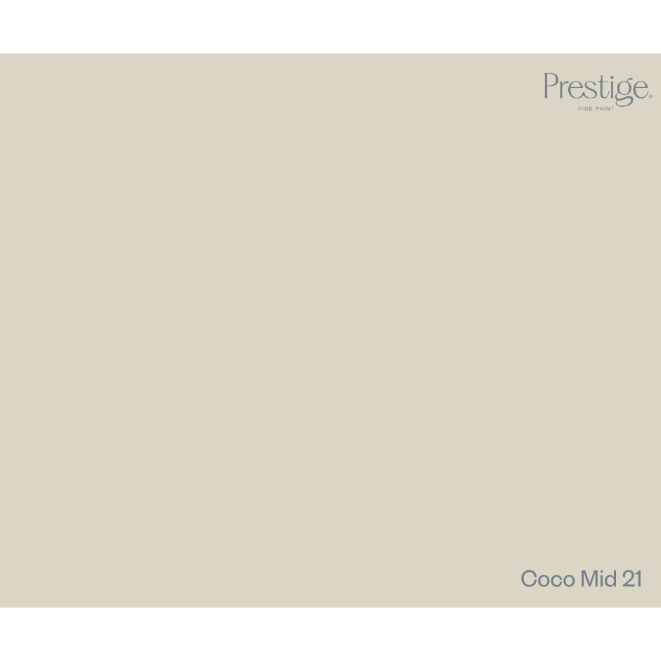 A solid color swatch card for Prestige Fine Paint in the shade Coco Mid 21, showing a warm light beige-gray color with the brand logo in the top right and the shade name in the bottom right.
Prestige Coco Mid