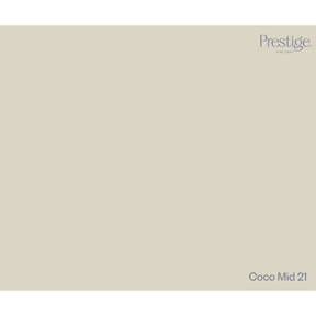 A solid color swatch card for Prestige Fine Paint in the shade Coco Mid 21, showing a warm light beige-gray color with the brand logo in the top right and the shade name in the bottom right.
Prestige Coco Mid