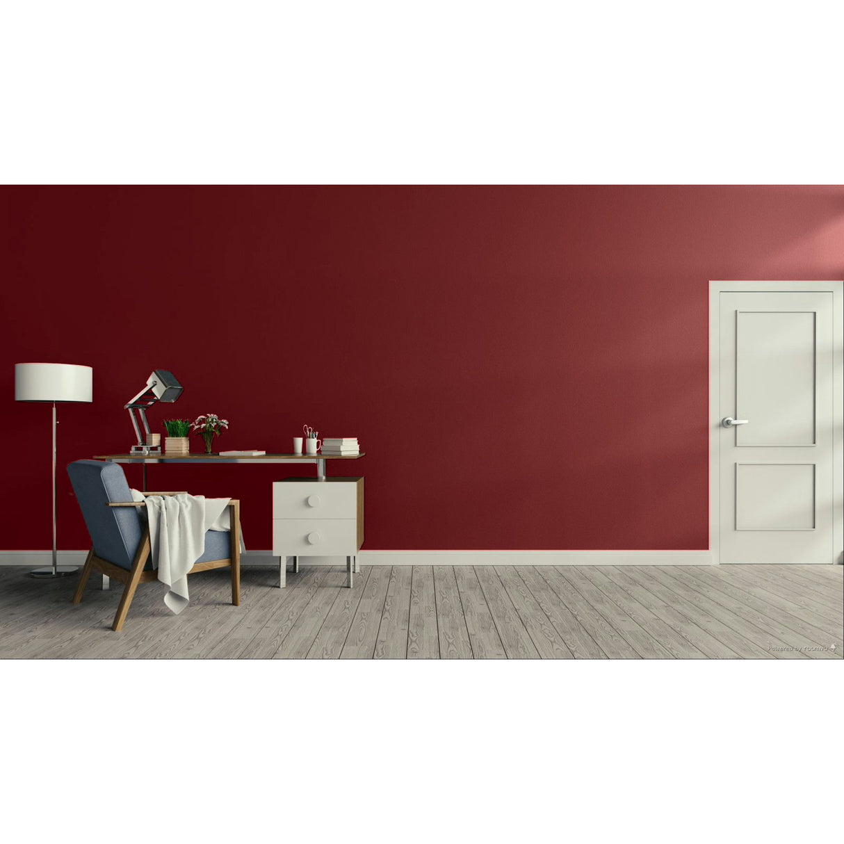 A modern room scene with a deep red wall, light gray wood floor, a white door on the right, and a home office setup on the left featuring a blue armchair, desk, lamp, and floor lamp. Prestige Hidden Notebook Paint