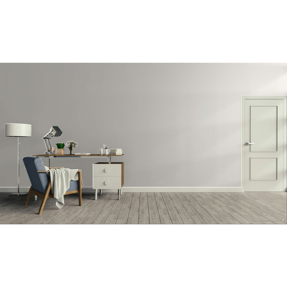 A minimalist interior room scene with a light gray wall, gray wood floor, a white door on the right, and a home office setup on the left featuring a desk, lamp, chair, and throw blanket.