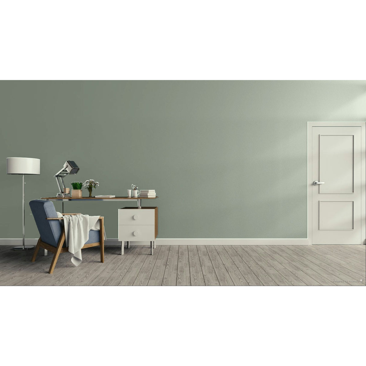 A minimalist room scene with a sage green wall, light wood floor, a white door on the right, and a home office setup on the left featuring a desk, lamp, chair, and small cabinet.