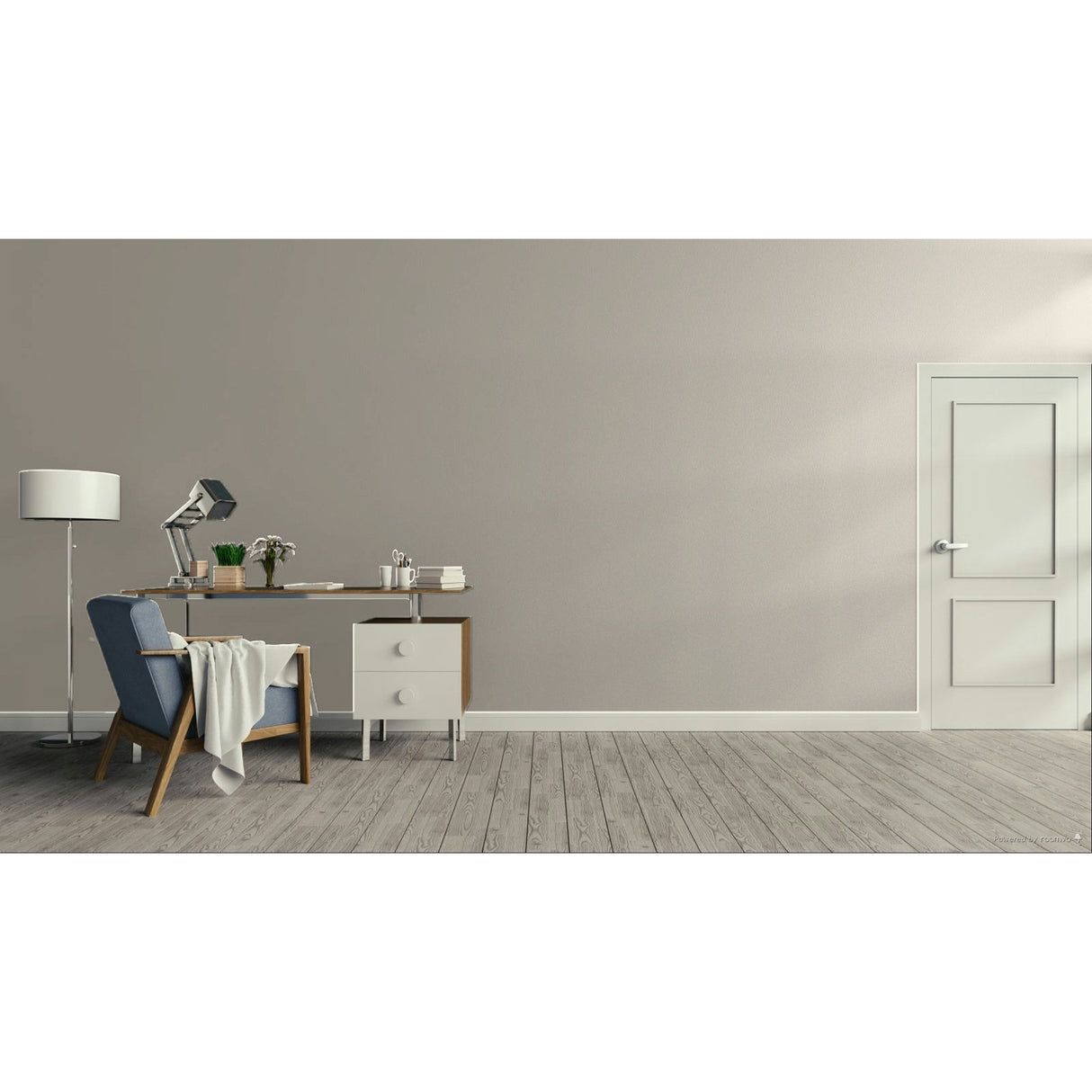 A minimalist room scene with a sage green wall, light wood floor, a white door on the right, and a home office setup on the left featuring a blue armchair, desk, lamp, and small cabinet.