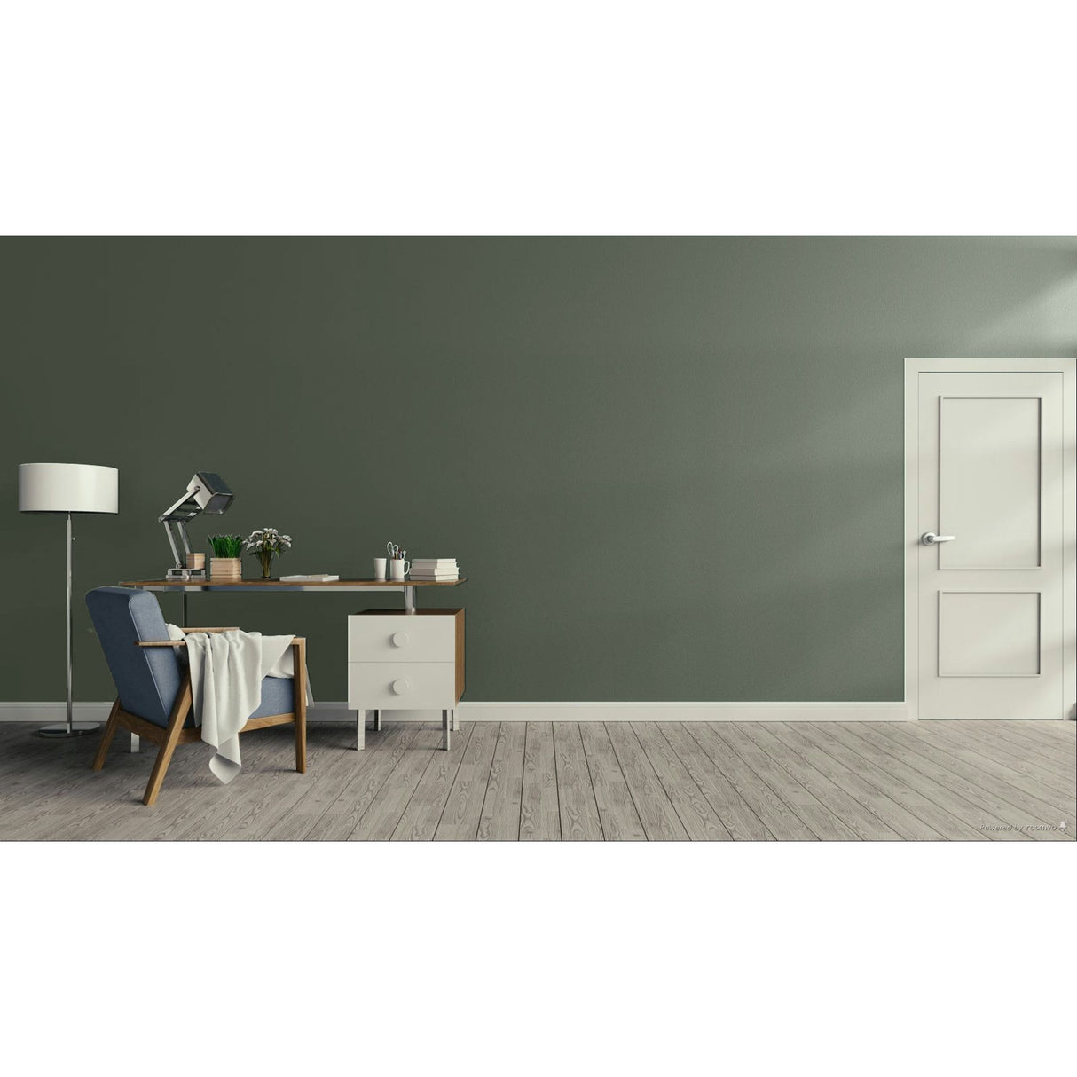 A minimalist room scene with a dark green wall, light wood floor, a white door on the right, and a home office setup on the left featuring a desk, lamp, chair, and throw blanket.