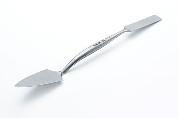 A stainless steel miniature trowel with a long handle and flat blade, shown diagonally on a clean white background.