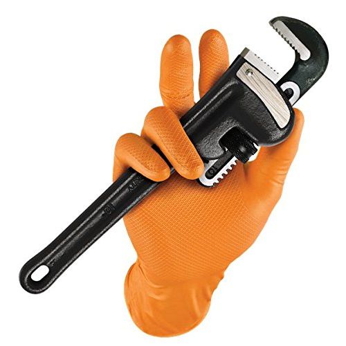 A black adjustable wrench held in a hand wearing a textured orange work glove, isolated on a white background.