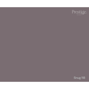 A solid color swatch card for Prestige Fine Furnishings, showing the color Snug 118, a muted dusty plum-gray. The Prestige logo is in the top right corner, and 'Snug 118' is labeled in the bottom right.
