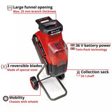 A red and black cordless leaf blower shown on a white background with callout lines and text describing features such as a large funnel opening, 36 V battery power, 3 reversible blades, and a collection sack.