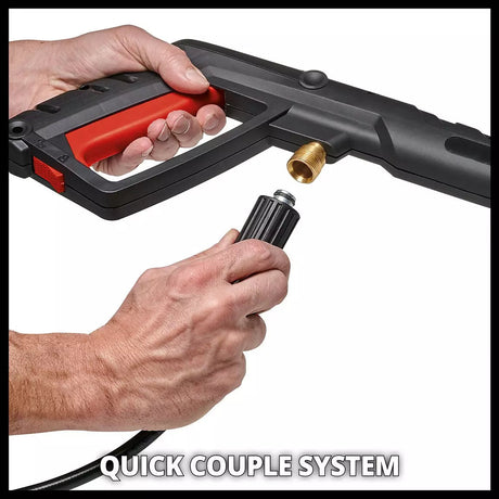 Close-up of a person's hands demonstrating a quick-coupling system on a black and red pressure washer nozzle, with a brass connector visible against a white background.