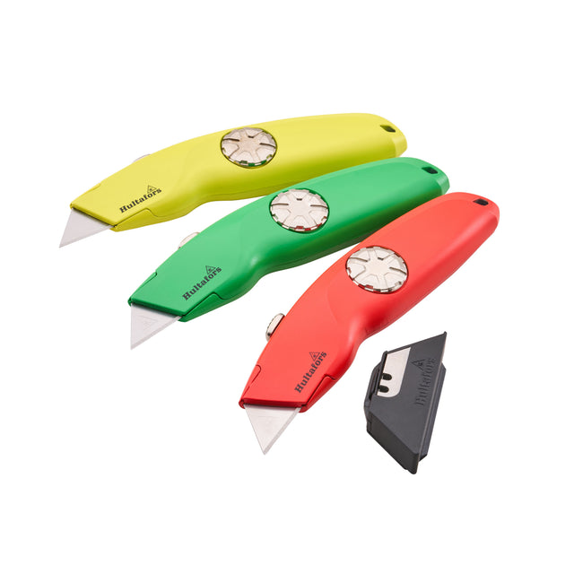 Three utility knives in yellow, green, and red are arranged diagonally on a white background, with a black spare blade holder at the bottom right. The brand name 'Hultabies' is visible on the handles.
Hultafors Hi-Vis Trimming Knife