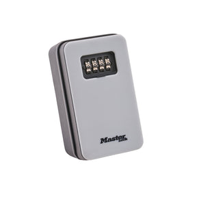A Master Lock combination key box in a metallic silver finish, featuring a black combination dial on the front and the Master Lock brand logo printed near the bottom.  MasterLock Key Lock Box - New Design