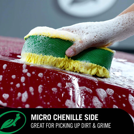 A hand washing a red car with a green and yellow sponge, with a black text banner at the bottom reading 'MICRO CHENILLE SIDE GREAT FOR PICKING UP DIRT & GRIME'. Turtle Wax M.A.X Power™ 3-in-1 Wash Pad