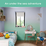 A styled children's bedroom with a pastel gradient wall transitioning from lavender to mint green, featuring a bed, vanity desk, chair, and window. A teal banner at the top reads 'An under the sea adventure'.