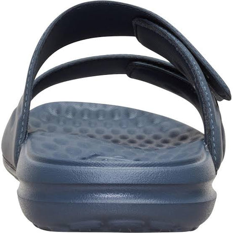 Navy blue sandal with a textured sole on a white background
