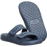 Blue sandals with textured sole on a white background