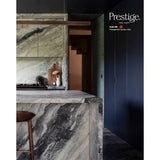 Prestige Ando
A modern kitchen interior featuring a large marble island and matching marble cabinetry in a green, gray, and white veined pattern, alongside dark navy cabinets and a wooden stool. The Prestige Elite Paint brand logo is visible in the top right corner.