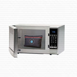 A stainless steel countertop microwave with its door open, showing a dark woven patterned pillow inside. The microwave has a digital control panel on the right side and is set against a white background with a faint repeating watermark pattern.