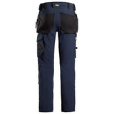 A pair of navy blue work pants with black utility pockets and a waist belt, shown from the back on a white background. Snickers 6271 AllroundWork Full Stretch Trousers Holster Pockets